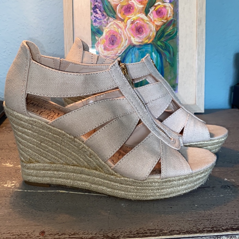 Espadrille wedge platform sandals.
Light khaki colored canvas in GUC size 9.5.